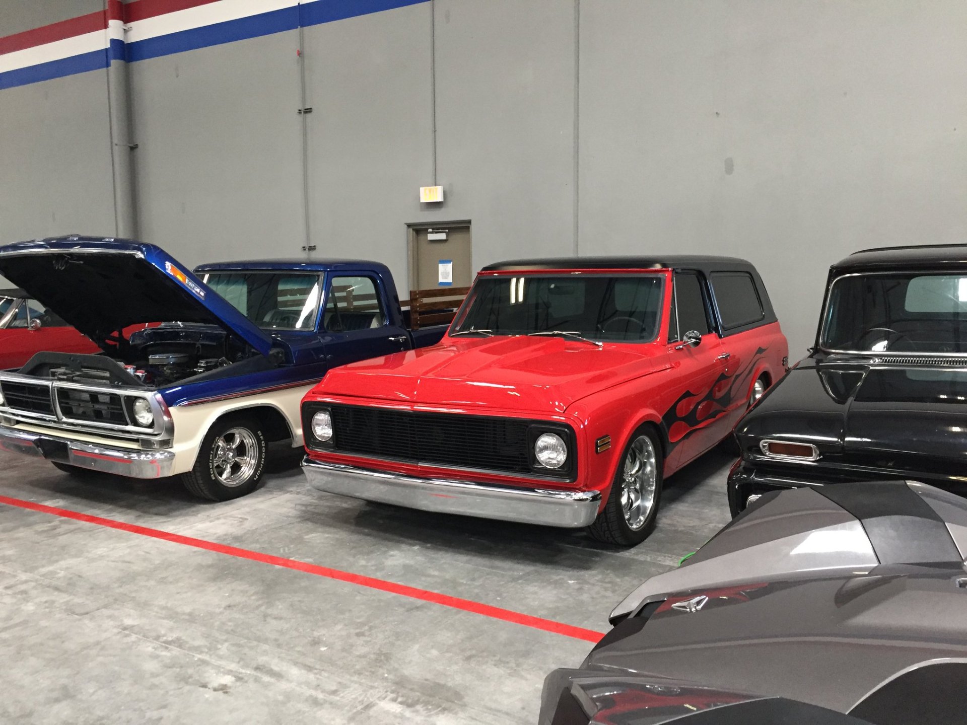 Custom flame Chevy Blazer and classic trucks in Las Vegas storage
